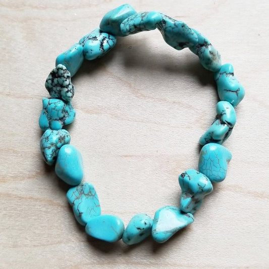 Turquoise stone bracelet on a light wooden surface