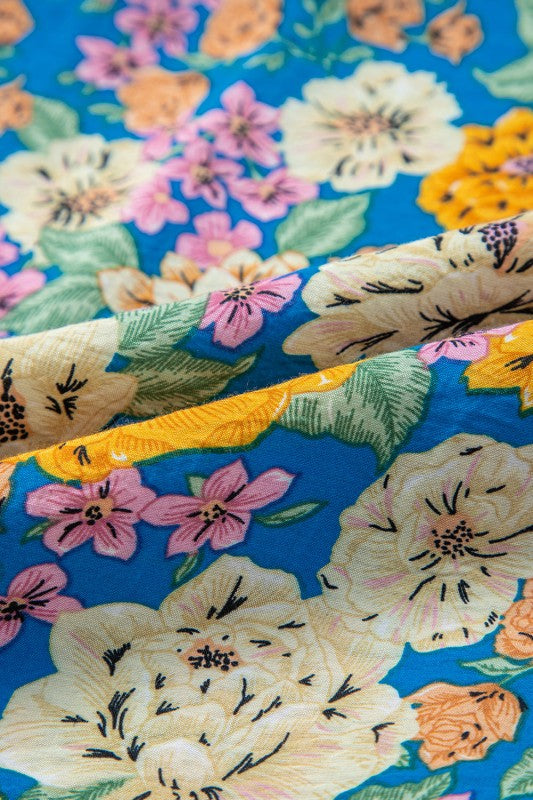 Close-up of floral-patterned fabric with a blue background